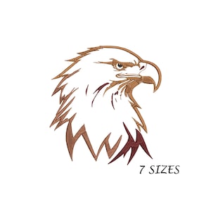 Op de afbeelding: Een bruin en rood lijnenkunst-borduurontwerp van een adelaarskop. Het ontwerp is verkrijgbaar in 7 maten.