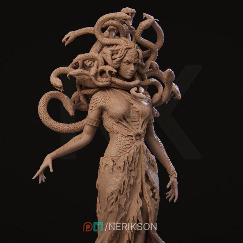 May include: A clay sculpture of Medusa, a mythical Greek figure with snakes for hair, wearing a flowing robe. Her face is sculpted with a fierce expression.