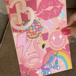 May include: Pink and white illustration with the letter "B" in a retro style, a disco ball, a pink flamingo float, roller skates, a rainbow, a pink flower, and a pink smiley face with glitter.