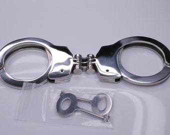 Hinged metal handcuffs