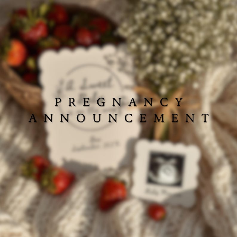 May include: A pregnancy announcement card with the words "Pregnancy Announcement" in black text. The card is surrounded by strawberries, flowers, and a small ultrasound photo. The overall aesthetic is soft and romantic.
