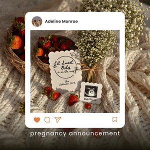 May include: A pregnancy announcement featuring a basket of strawberries, a bouquet of white flowers, and two cards. One card reads "A Sweet Baby is on the way" and the other displays a sonogram. The text "pregnancy announcement" is at the bottom.