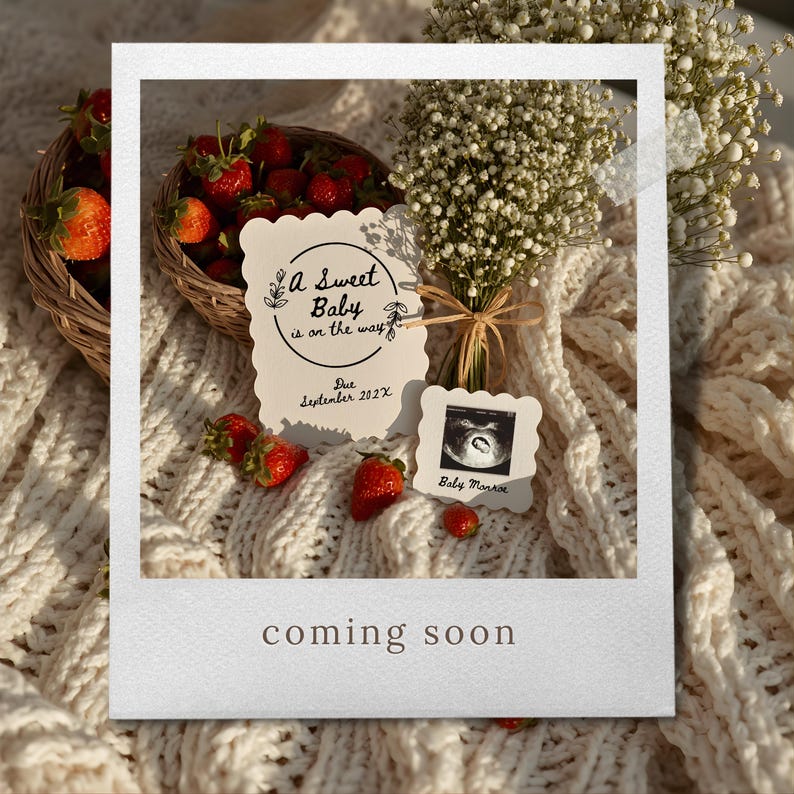 May include: A pregnancy announcement with a basket of strawberries, a bouquet of white flowers, and two cards. One card reads "A Sweet Baby is on the way" and the other shows a sonogram image. The text "coming soon" is at the bottom.