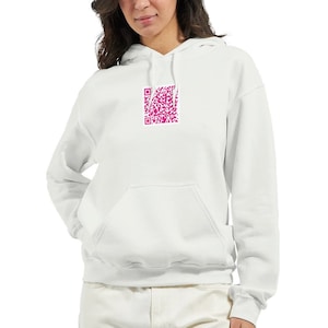 May include: A white hoodie with a pink QR code printed on the front.
