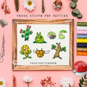 May include: Cross stitch pattern featuring eight different Pokemon characters, including a cactus Pokemon, a tree Pokemon, and a bee Pokemon. The pattern is displayed in a wooden frame on a pink background. The text "CROSS STITCH PDF PATTERN" is at the top of the frame and the text "CRAFTPATTERNHUB" is at the bottom of the frame.