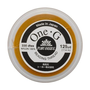 Linha de nylon laranja Toho One-G 0,2 mm 125 jardas para bijuterias e trabalhos manuais com miçangas. Resistente e encerada, fabricada no Japão.