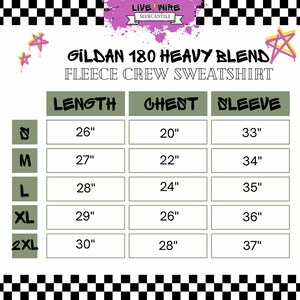 May include: A size chart for a Gildan 180 Heavy Blend fleece crew sweatshirt. The chart displays measurements for length, chest, and sleeve in inches for sizes S, M, L, XL, and 2XL. The image has a black and white checkered border.