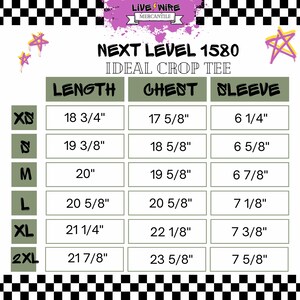 May include: A size chart for the "Next Level 1580 Ideal Crop Tee" with measurements in inches. The chart includes length, chest, and sleeve dimensions for sizes XS to 2XL. The background has a black and white checkered pattern.