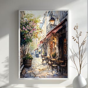 May include: A watercolor painting of a Parisian street scene with a cafe on the corner. The cafe has a red awning and a sign that says "Le Cafe". There are tables and chairs set up outside the cafe, and people are sitting and enjoying the sunshine. The street is cobblestone and there are trees and flowers lining the street.