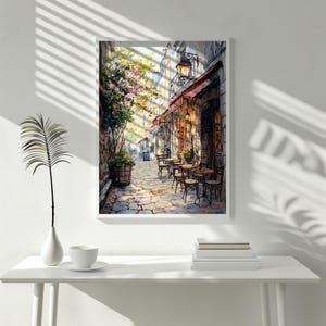 May include: A watercolor painting of a Parisian street scene with a cafe on the corner. The cafe has a red awning and tables and chairs set up outside. There are trees and flowers in the background.
