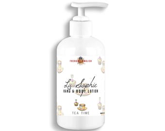 May include: White hand and body lotion bottle with a pump dispenser. The label features the text "La Sophie Hand & Body Lotion Tea Time" with illustrations of teacups and pastries. The top of the bottle has the text "French English".