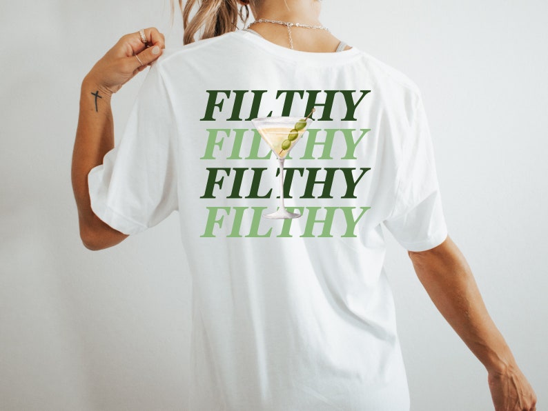 May include: White t-shirt with the text "FILTHY" repeated four times in green and black lettering. A green martini glass with an olive is centered on the shirt.