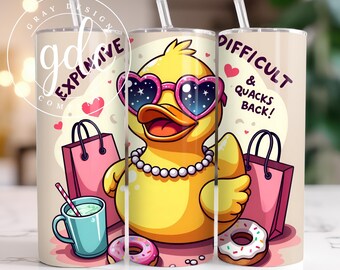 May include: A yellow rubber duck with pink sunglasses and a pearl necklace is holding a pink shopping bag. The duck is on a light brown background with pink hearts, donuts, and a blue mug with a straw. The text "Difficult & Quacks Back!" is on the right side of the image.