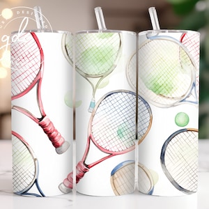 May include: Three white stainless steel tumblers with a watercolor design of tennis rackets and tennis balls. The tumblers are perfect for sports fans and tennis enthusiasts.