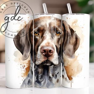 May include: A watercolor illustration of a German Shorthaired Pointer dog's head with brown and white fur. The dog's eyes are brown and the background is a light brown watercolor wash.