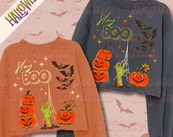 May include: Two cropped Halloween sweatshirts, one orange and one gray, featuring a "Stay BOO" design. The design includes stacked jack-o'-lanterns, bats, a zombie hand, and stars. The word "HALLOWEEN" is in the upper left corner.
