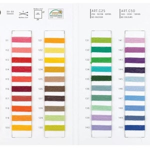 May include: A color chart for Hello DK Cotton yarn. The chart shows 60 different colors of yarn, organized into 6 columns of 10 colors each. The colors range from light pink to dark blue. The chart is labeled with the numbers 101-160.