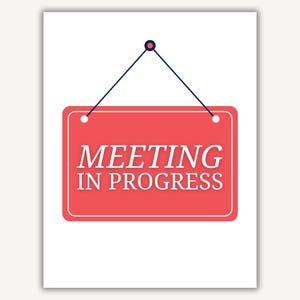 May include: A red sign with white text that says "Meeting in Progress" hanging from a blue string with a black circle at the top.