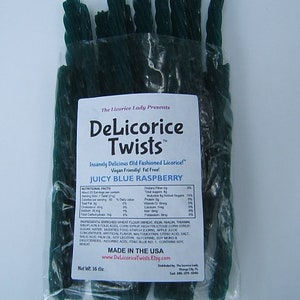 May include: A bag of green licorice twists called "DeLicorice Twists" with the flavor "Juicy Blue Raspberry". The bag is labeled "Insanely Delicious Old Fashioned Licorice!" and "Vegan Friendly! Fat Free!" The bag is 16 ounces.