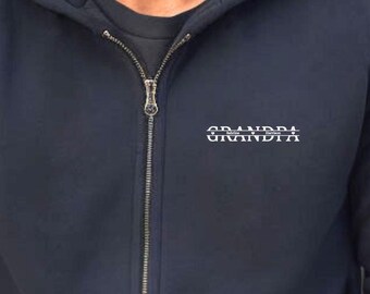 May include: A navy blue zip-up hoodie with a white embroidered design that reads "GRANDPA" on the front.