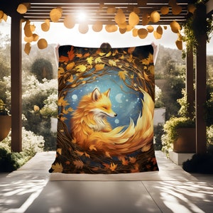 May include: A cozy blanket featuring a stylized illustration of a fox curled up in a circle of autumn leaves. The fox is orange and yellow with a white chest and a fluffy tail. The background is a dark blue with white stars and a crescent moon.