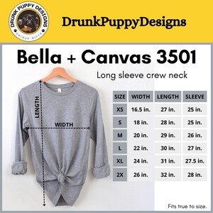 May include: A gray Bella + Canvas 3501 long sleeve crew neck t-shirt with size chart showing measurements in inches. The chart includes sizes XS, S, M, L, XL, and 2X.