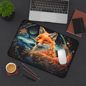 May include: A colorful mousepad featuring a stylized orange fox with a galaxy background. The fox is surrounded by swirling colors and intricate details.