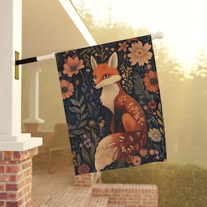 May include: A fox with orange fur and a white chest sits in a field of colorful flowers. The fox is surrounded by green leaves and flowers in shades of pink, purple, and yellow. The background is a dark blue.