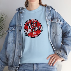 May include: A light blue t-shirt with a red circle logo that says "Gentlemen's West Brovinas - A Cappella - Est. 2012".