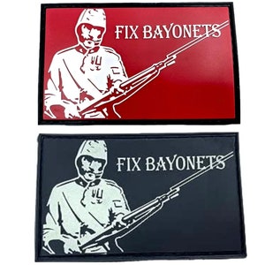 May include: Two embroidered patches featuring a white silhouette of a soldier holding a rifle. The text "FIX BAYONETS" is above the soldier on both patches. One patch is on a red background and the other is on a black background.