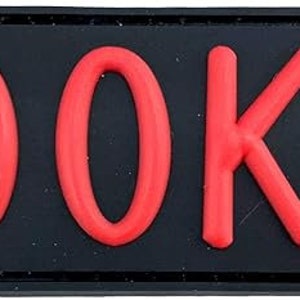 May include: Black patch with the word "ROOKIE" in red lettering.