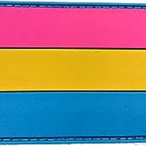 May include: A pink, yellow and blue patch with a stitched border. The patch is a representation of the pansexual pride flag.
