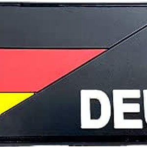 May include: Black and white patch with the German flag and the text "DEU" in white.