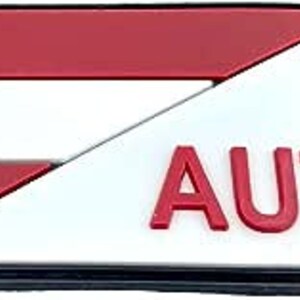 May include: A red, white and red Austrian flag patch with the letters "AUT" in white.