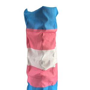 May include: A blue, pink and white striped fabric neck gaiter. The fabric is folded and bunched up, creating a textured look.