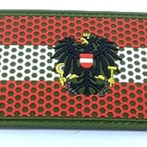 May include: Rectangular patch featuring the Austrian flag design. The patch has a red honeycomb background with a white stripe and a detailed emblem of a black eagle with a red and white shield. The border is green.