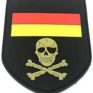 May include: Black and gold embroidered patch with a skull and crossbones and a German flag above it.