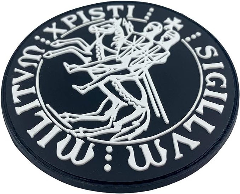 May include: Black and white patch with a circular design. The center features a stylized image of a knight riding a horse. The text around the image reads "SIGILLVM: WLLVM: XPISTI".