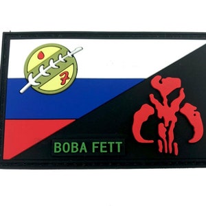 May include: A black and white patch with a red and green symbol and the text "BOBA FETT".