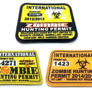 May include: Three yellow and orange zombie hunting permits with black text and a biohazard symbol. The top permit is for 2012/2013, the middle permit is for 14271 and the bottom permit is for 2014/2015.