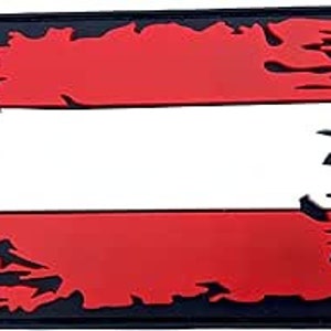 May include: A distressed, black, white and red patch with the Austrian flag design. The patch has a frayed, torn edge.