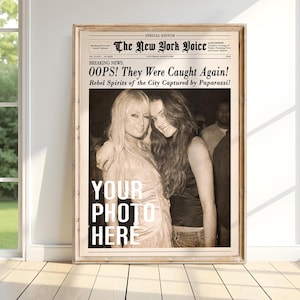 May include: Framed print resembling a vintage newspaper front page. The headline reads "OOPS! They Were Caught Again!" with the text "YOUR PHOTO HERE" in bold white letters. The image features two women in a sepia tone.
