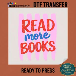 May include: A DTF transfer sheet featuring the text READ more BOOKS in a distressed red and blue font. The design is layered over five vertical light pink brushstroke stripes on a white background. The text ABNNCustomCloset is at the top.