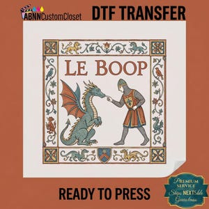 May include: A square DTF transfer featuring a medieval-style illustration of a knight in chainmail touching the nose of a green dragon. The text LE BOOP is centered above. The design is framed by a decorative border with floral motifs and small creatures.