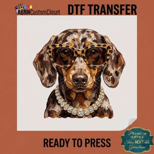 May include: A DTF transfer featuring a dapple dachshund wearing leopard print glasses and a gold-toned rhinestone necklace. The design includes the text ABNNCustomCloset DTF TRANSFER and READY TO PRESS. The dog has brown and black fur markings.