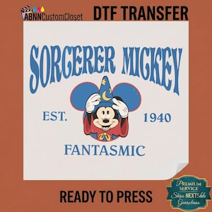 May include: A DTF transfer sheet featuring a graphic of Sorcerer Mickey wearing a blue wizard hat with yellow moons and stars. The text reads SORCERER MICKEY, EST. 1940, and FANTASMIC. The design includes a blue Mickey Mouse ear silhouette background.