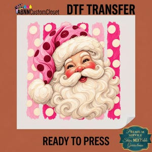 May include: A DTF transfer sheet featuring a graphic of Santa Claus wearing a pink hat with dark pink polka dots. Santa has a thick white beard and mustache. The background consists of vertical pink brushstroke stripes and white polka dots. Text reads ABNNCustomCloset DTF TRANSFER READY TO PRESS.