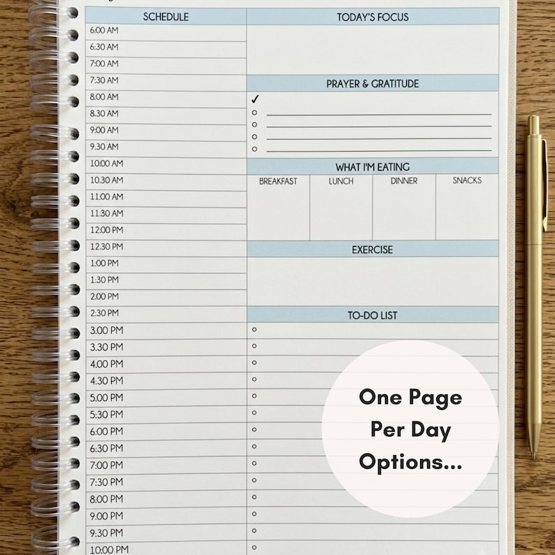 May include: A spiral-bound daily planner page with a schedule from 6:00 AM to 10:00 PM, sections for Today's Focus, Prayer & Gratitude, What I'm Eating, Exercise, and a To-Do List. A gold pen sits to the right. Text reads: One Page Per Day Options...