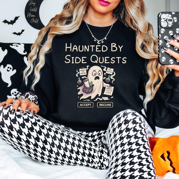 haunted by side quests sweatshirt funny adhd halloween shirt for overwhelmed moms burnout ghost gift relatable spooky cozy gildan sweatshirt