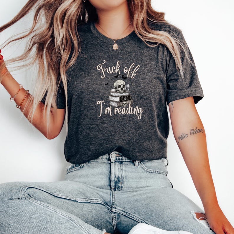 Fuck Off I'm Reading Unisex T-Shirt Skull and Books Graphic Sarcastic Halloween Tee Book Lovers Halloween Shirt for Introverts T-shirt Dark Grey Heather